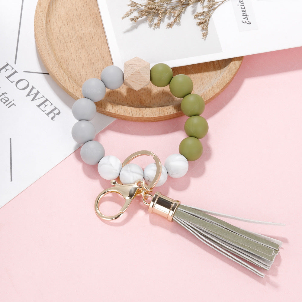 Venta al por mayor de silicona con cuentas de cuero PU borla pulsera pulsera